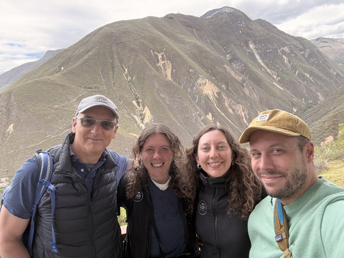 ICT team members with roaster partners in the mountains on a trip to origin