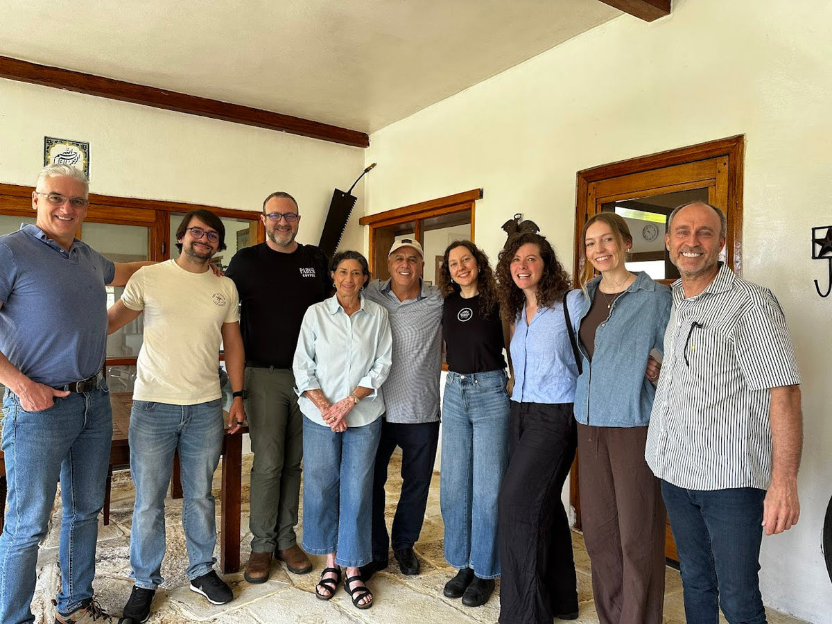 Group gathered together indoors during a farm visit in Nicaragua
